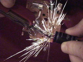 How Can I Safely Make Sparks For A Film Shoot Specialeffects Fx Here S The Guts Of A Disposable 35 Mm Camera Having Flash Capacitor Shorted Out With Swiss Army Knife